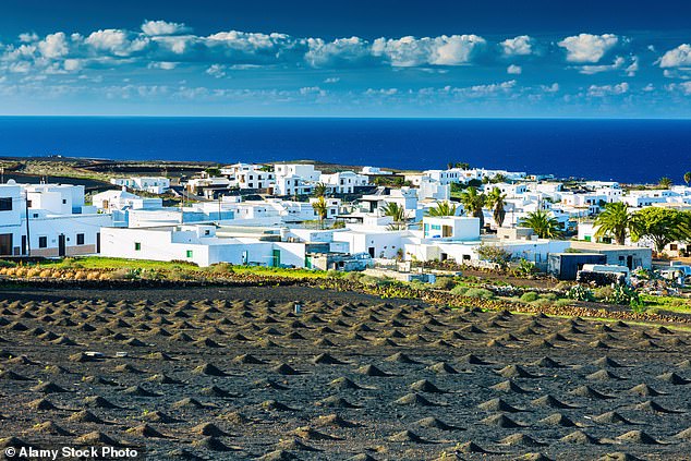 Striking: The white houses of Lanzarote which traditionally have green or marine-blue doors
